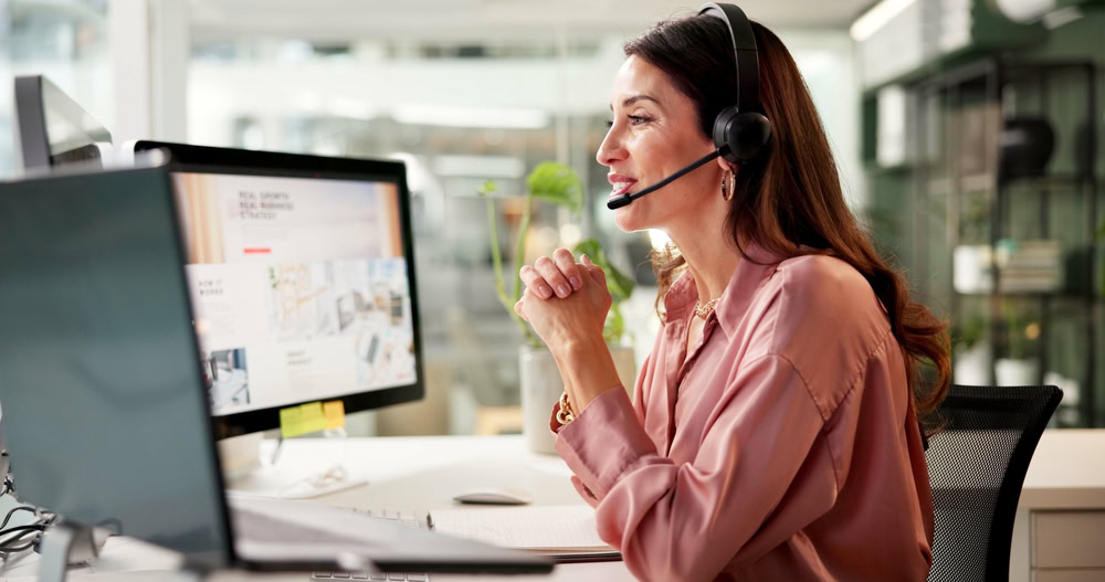 Woman, mic and computer screen at call center in office for crm, customer service and sales information. Girl, talking and headset for telemarketing, technical support and feedback with legal advice.