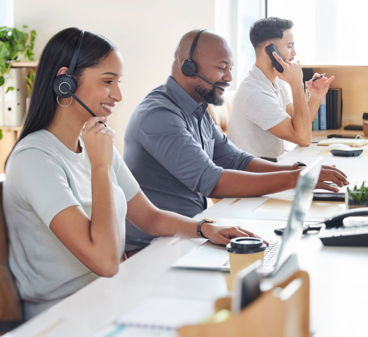 Multicutural call center, customer service or support with consultant people at work in an office for assistance. Contact us, crm or consulting with a group of employees using headset technology for telemarketing.