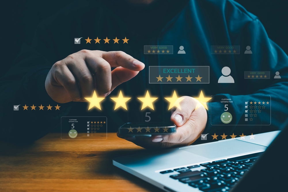 Customer leaving a five-star rating on a mobile device, representing positive customer feedback and satisfaction