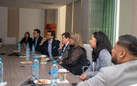 Group of Confie employees attending a business meeting