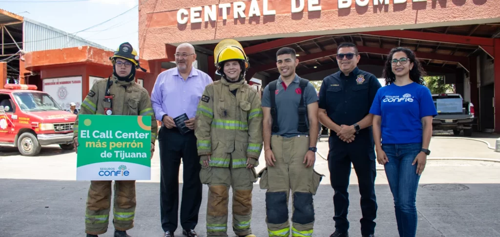Confie members alongside firefighters in front of Tijuana's Fire Department