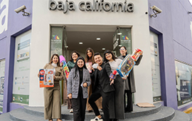 Confie employees load the overflowing Juguetón box of toys to be delivered to TV Azteca.