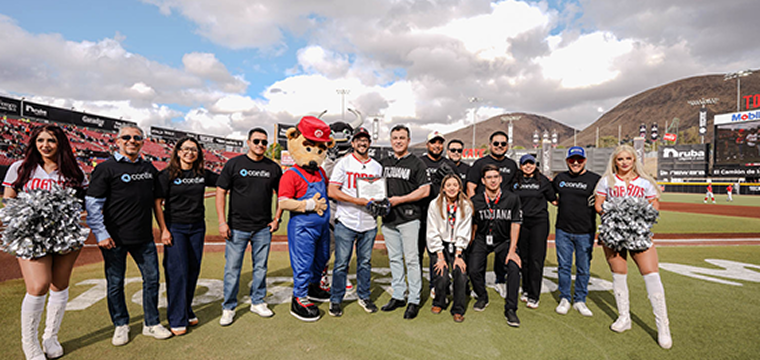 Toros Director Felix Fuentes Aguirre and the Confie Senior Leadership Team join together on the field to illustrate the alliance between the two organizations.