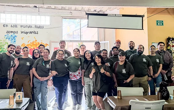 Volunteers serving meals at Desayunador Salesiano A.C. in Tijuana, Baja California