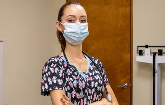 A doctor in her office.